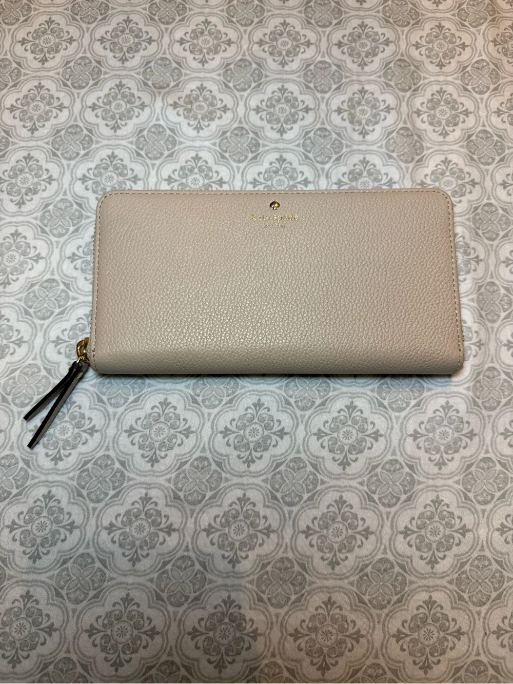 kate spade pebble leather zip-around wallet